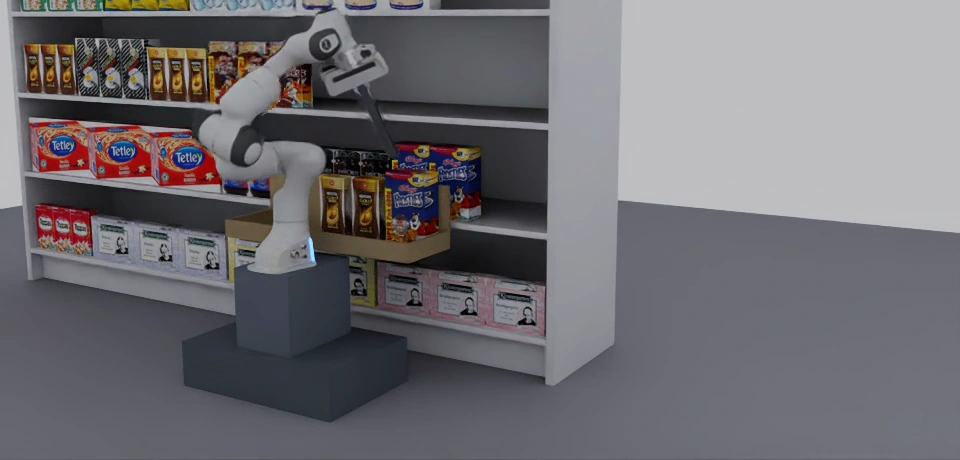 A simulated DRAY robot handling grocery products beside a stocked shelf